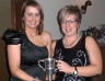 Joanne Kirgan presents the Ciara McLaughlin Memorial Cup for Camogier of the year to Margaret O'Neill